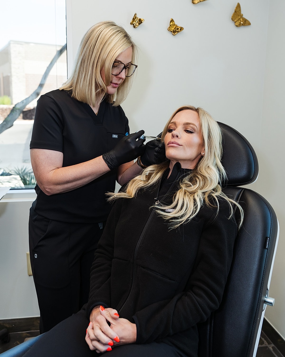 Botox injection procedure on a woman's forehead.