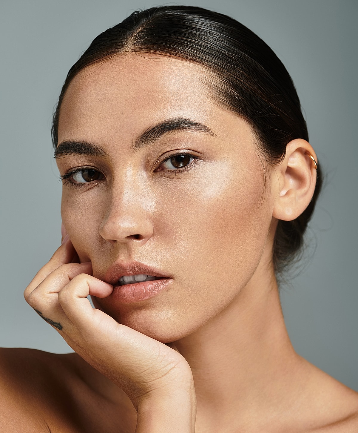 Close-up portrait of thoughtful young woman.