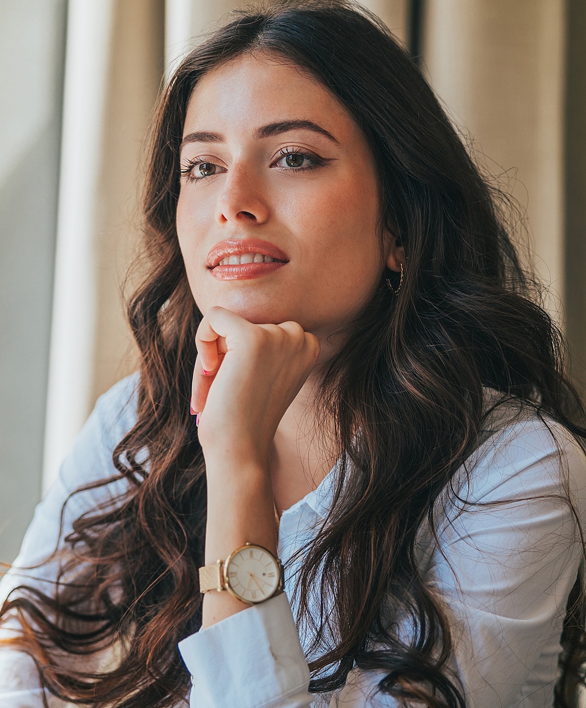 Woman in black outfit with long hair.