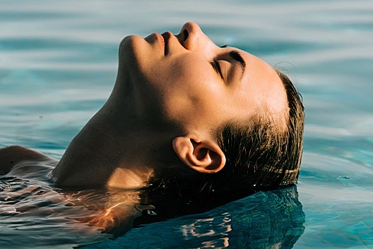 Botox injection procedure on a woman's forehead.