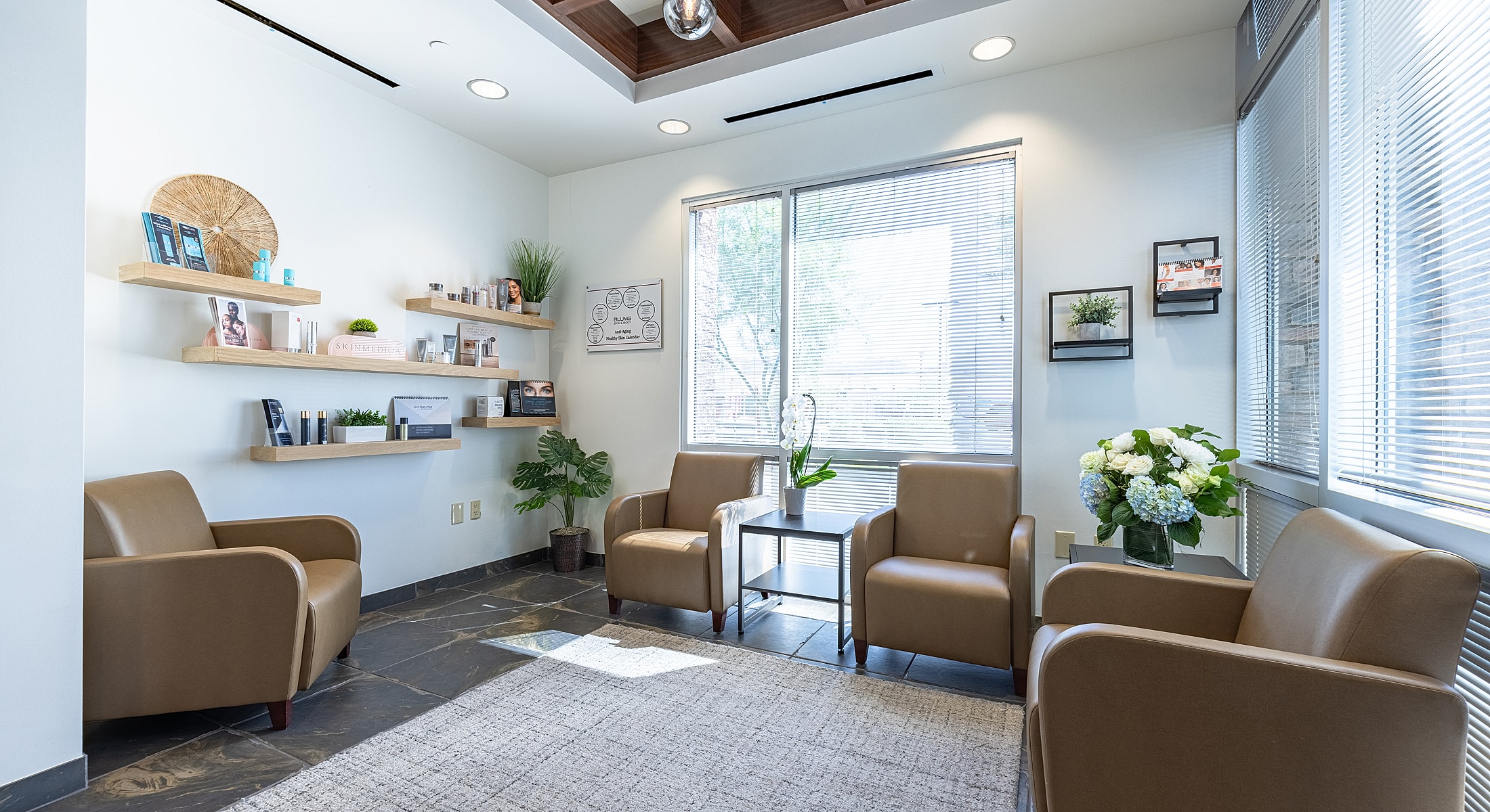 Modern waiting area with stylish decor and plants.