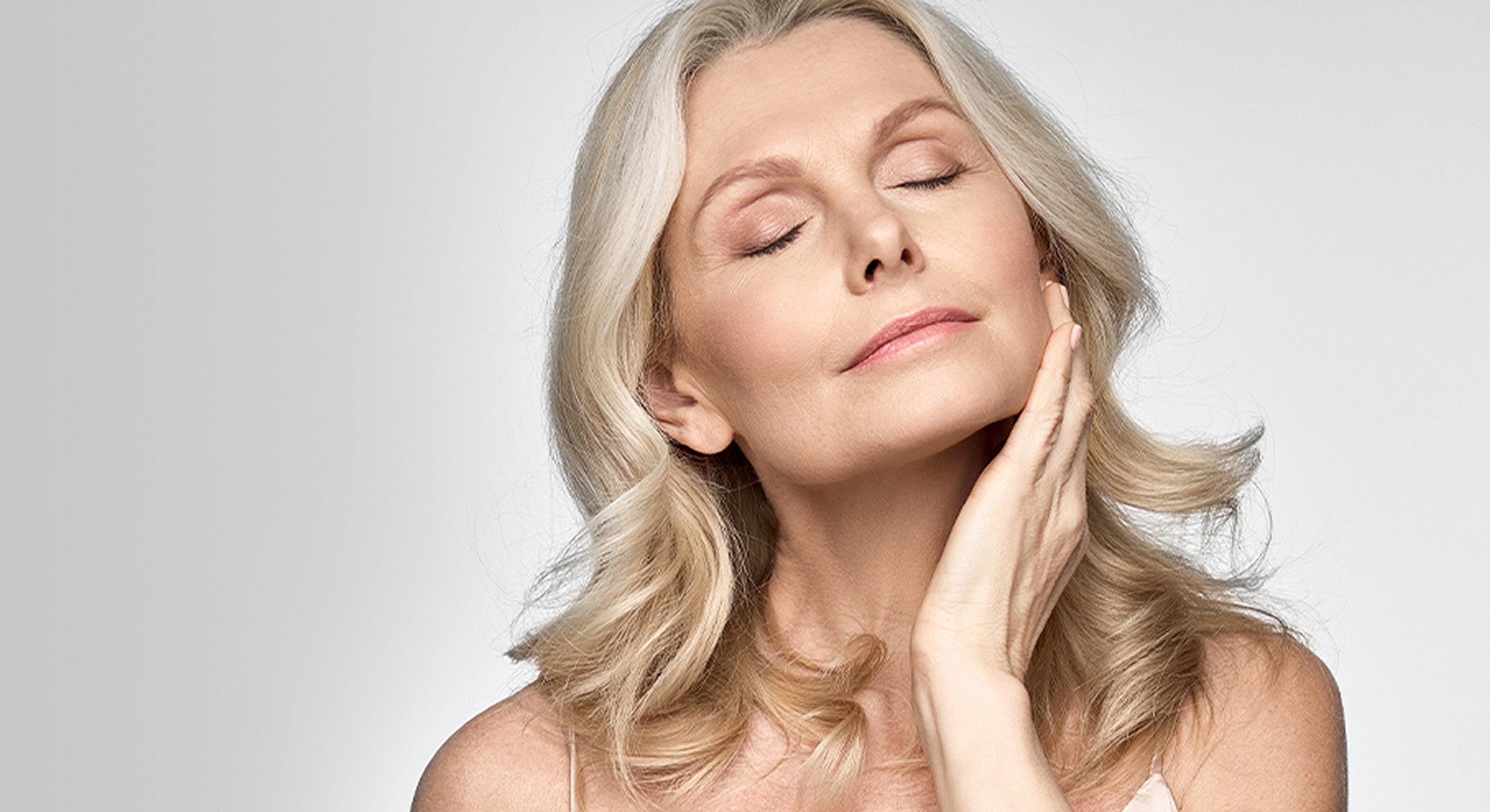 Woman with closed eyes and serene expression.